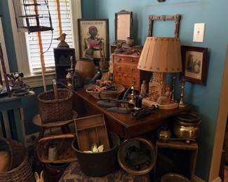 Primitive table display - copper, baskets, lamps