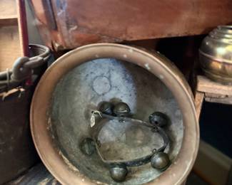 Antique brass sleigh bells and copper pot