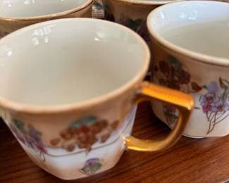 Hand painted porcelain teacups with gold handles