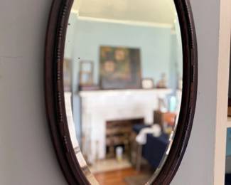 Antique oval beveled wall mirror, wood frame