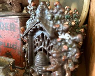 Antique cast metal beehive bank and tintype photos