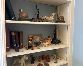 Shelf of folk art carvings and animal figurines