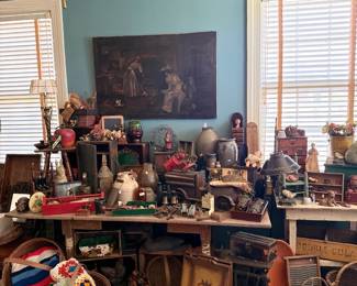 Room of primitives, baskets, art, and area rugs
