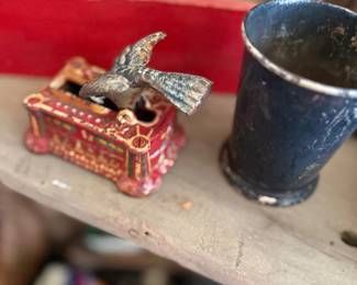 Antique cast iron eagle bank and graniteware cup