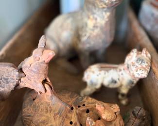 Folk art carved animals and pottery rabbit