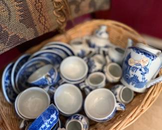 Child's blue willow china tea set in basket