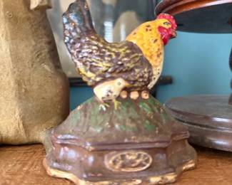 Antique cast iron hen on nest bank