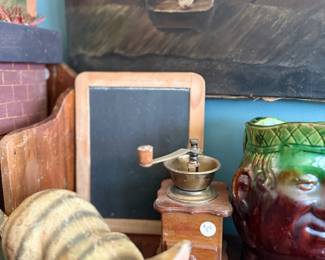 Cast iron cat doorstop, antique coffee mill, face jug