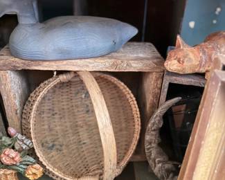 Antique duck decoy and round splint basket