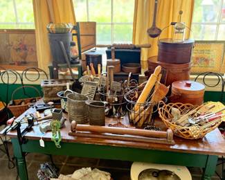Green painted farm table with primitive kitchenware