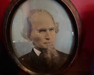 Antique portrait photograph in oval wood frame