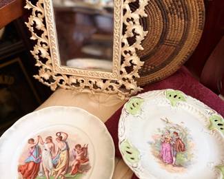 Ornate gilt mirror and classical scene plates