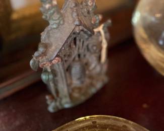Miniature bronze cottage figure and glass dome