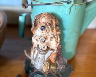 Vintage watering can and chalkware puppy figure
