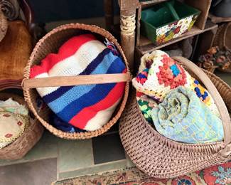 Vintage quilts and afghans in large splint baskets