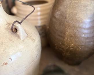 Antique stoneware jugs with wire bail handle
