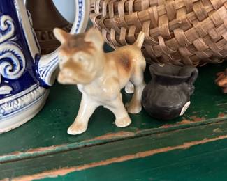 Porcelain dog figurine and blue salt glaze stein