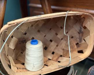 Antique splint basket with sewing thread