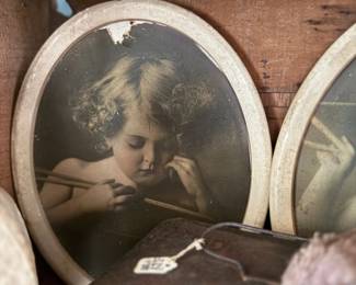 Cupid Asleep print close-up, oval frame