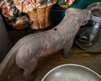 Cast iron flower basket doorstop and pewter candlestick
