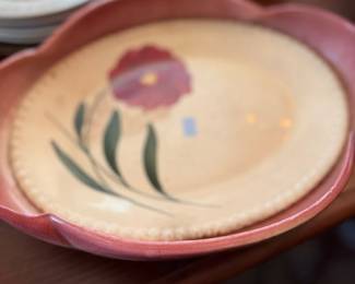 Vintage hand painted pottery plate with flower