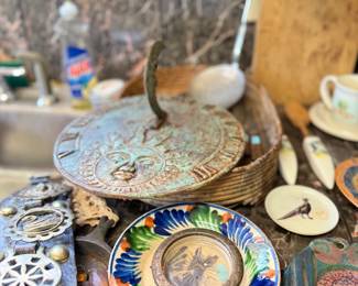 Brass trivet, majolica plate, and decorative dishes