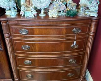 Mahogany bowfront chest with Dresden figurine display