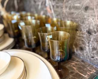Amber glass tumblers and gold rim china