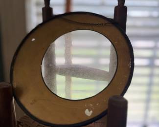 Antique magnifying lens on wood stand