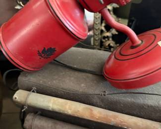 Vintage red painted metal watering can