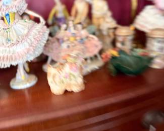 Dresden porcelain lace figurines on dresser