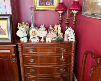 Mahogany chest, gilt mirror, ruby lamps, porcelain figurines