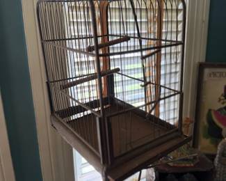 Antique wire bird cage on stand