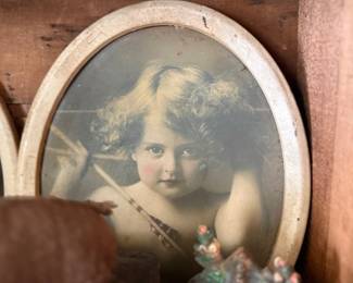 Antique Cupid Awake child print in oval frame