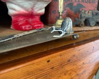 Vintage Santa figure and brass candlestick on mantel