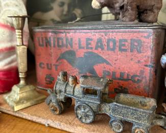 Union Leader tobacco tin and cast iron train toy