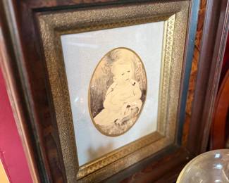 Victorian child portrait in ornate walnut frame