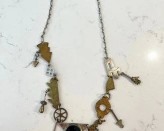 148-J: Thomas Mann “Techno-Romantic” Style Charm Necklace