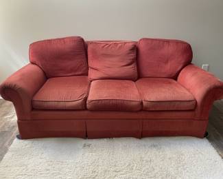 Vintage Red Upholstered Sofa with Rolled Arms and Skirted Base