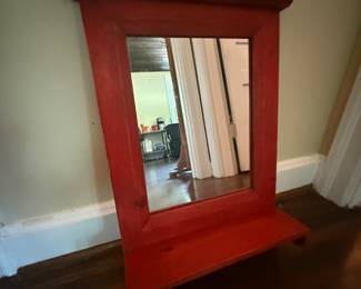 Small wooden wall mirror