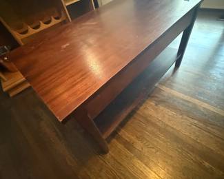Dark wood coffee table with lower shelf