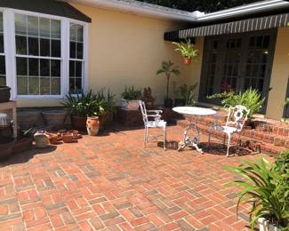 Patio with lots of potted plants and pots. Terra cotta, ceramic and resin.