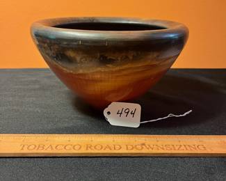 A494 - $25. Orange with Black Rim Vessel signed - TW. Measures 8.5" x 5" tall. 