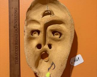 A469 - $40. Clay Mask by Barbara Haring. Measures 7" x 11.25". 