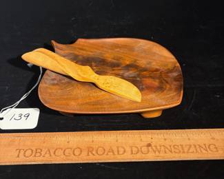 A139 - $60. Holly Tornheim: Wood Art Cheese Plate and Knife. Measures 6.5" x 7". 