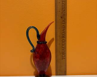 A467 - $65. Red swirl Glass Pitcher - signed Nunwell 1995.  Measures 4" x 5" tall. 