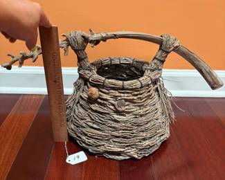 A19 - $60. Samuel Yao: Natural Woven Basket. Ann Arbor, MI. Measures 22" x 11.5" tall. 