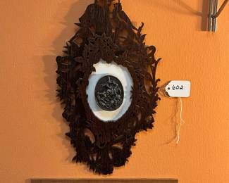 A602 -$350. Black Forest Carved Frame with Silver .999 Henryk Winograd Paperweight. Measures 8" w x 14.5" tall