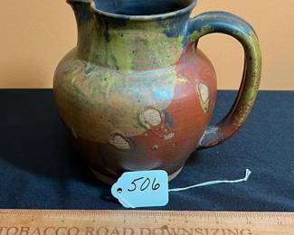 A506 - $20. Unsigned Pottery Pitcher. Measures 6.5" x 6.75" tall. 