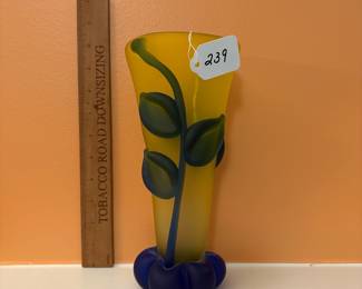 A239 - $140. Tommie Rush: Yellow Glass Vase With Botanical Design. Measures 4.5" x 10" tall. 